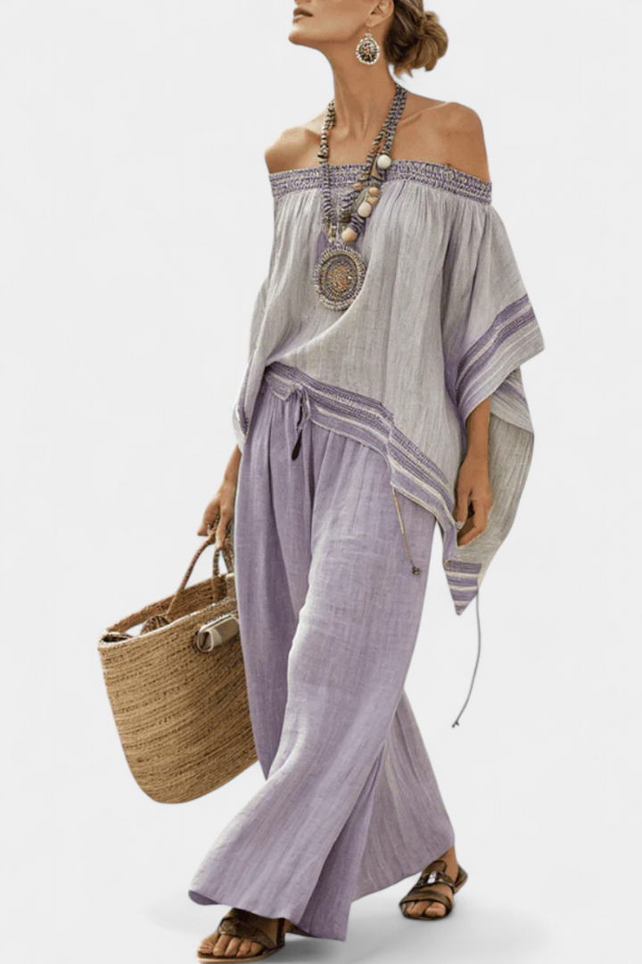 Completo in lino di bambù a righe, con spalle scoperte e pantaloni larghi per uno stile elegante e fresco