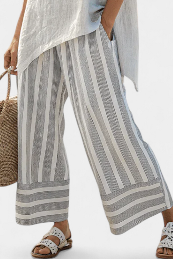 Fiorella – blusa asimmetrica elegante e pantaloni a righe